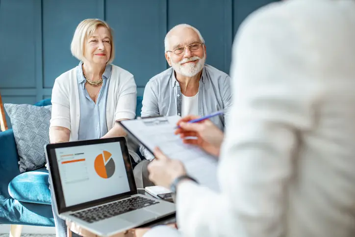 Seniors consulting Medicare with a Hello Insurance guide