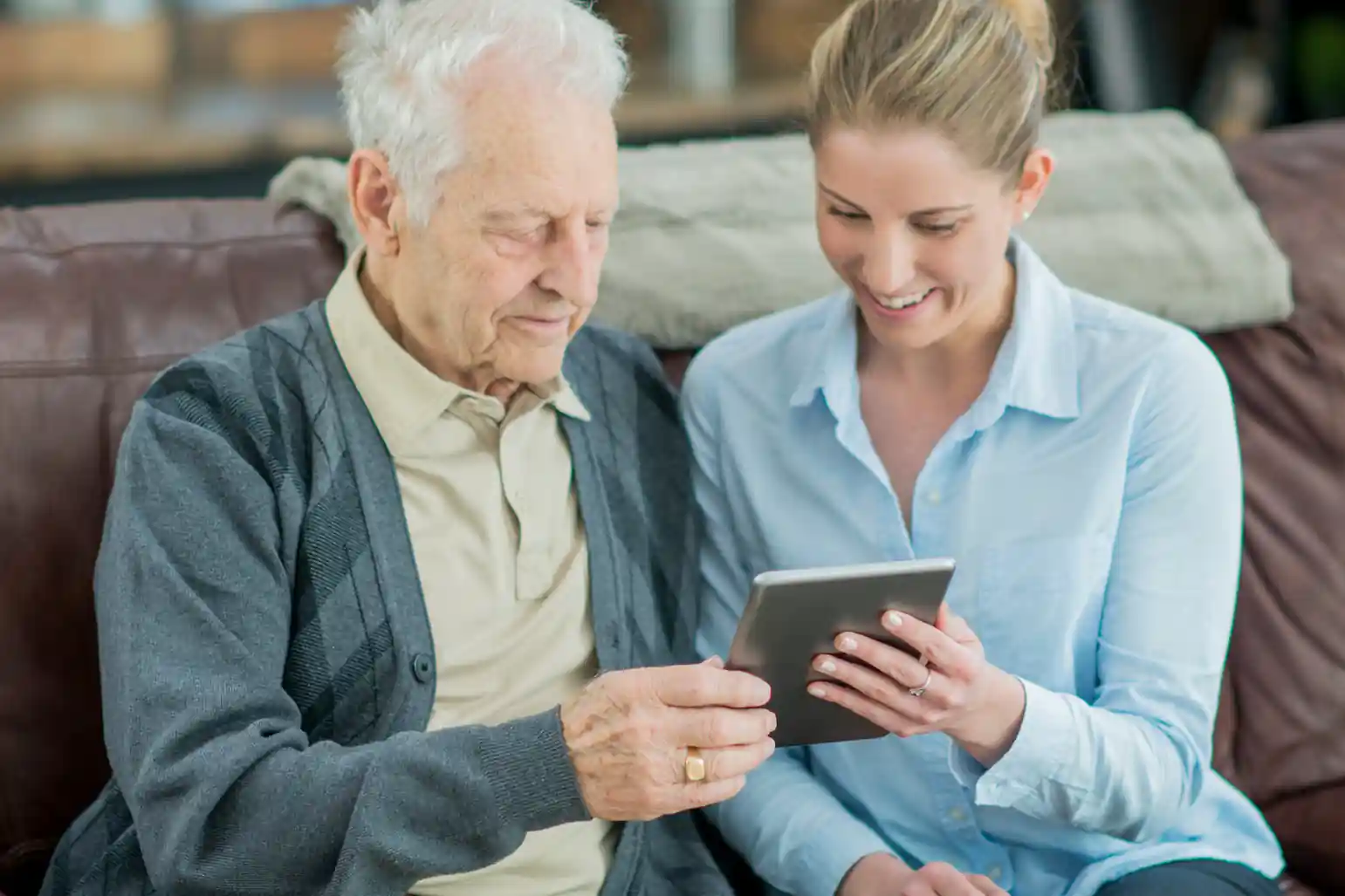 Young Woman Helping A Senior Man